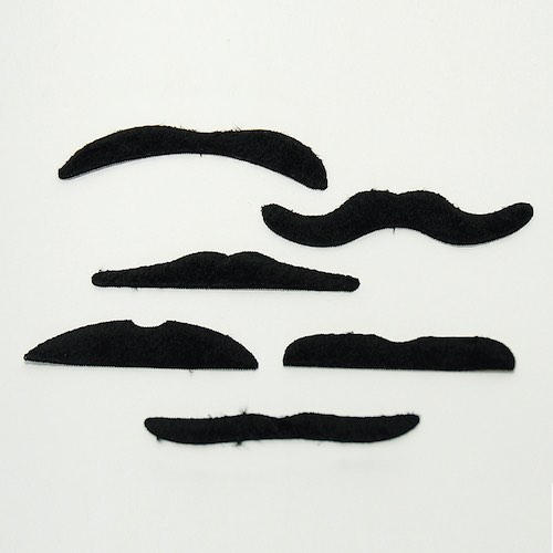Stick on moustaches inside the Stripey Pom Pom Crackers by Meri Meri.